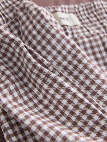 Shorty di self. in marrone