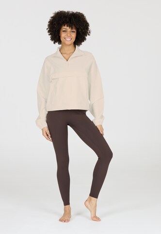Athlecia Performance shirt 'Carley' in Beige