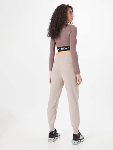 Nike Sportswear Zúžený Kalhoty 'Tech Fleece' – šedá
