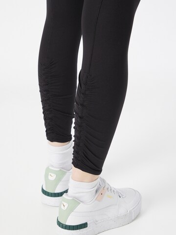 Skinny Pantalon de sport 'Studio Foundation' PUMA en noir