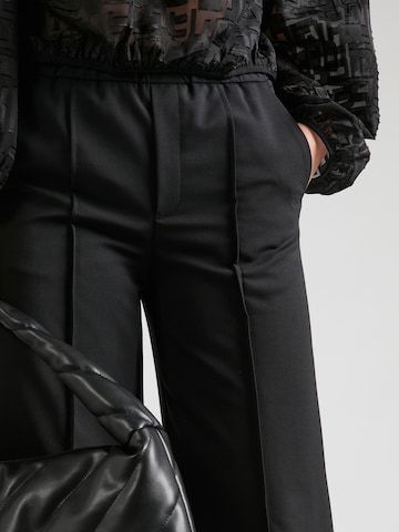 Wide leg Pantaloni con piega frontale 'EARN' di DRYKORN in nero