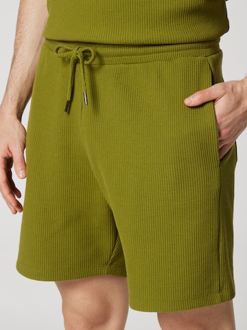 ABOUT YOU x Kevin Trapp Regular Pants 'Simon' in Green