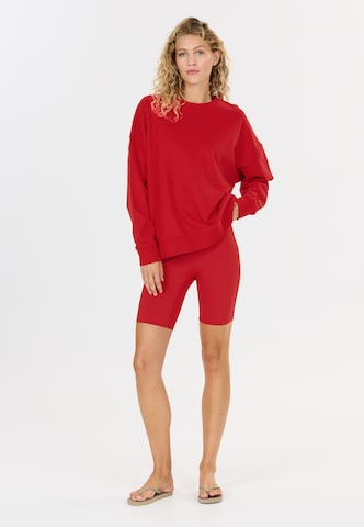 Athlecia Slim fit Sports trousers 'Blossom' in Red