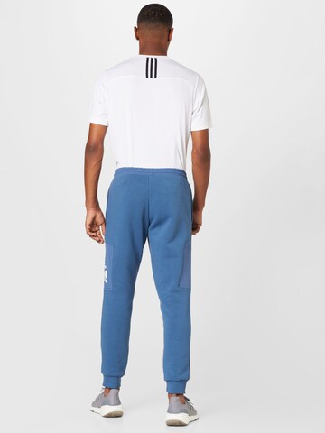 ADIDAS SPORTSWEAR Tapered Sporthose 'Essentials Brandlove Fleece' in Blau