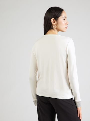 Tricou de la monari pe bej