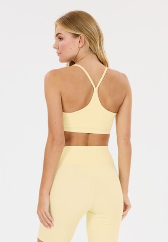 Athlecia Low Support Sport-BH 'Blossom' in Gelb
