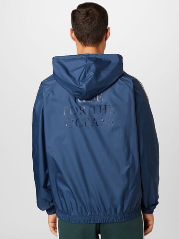 ADIDAS ORIGINALS Jacke 'Graphics Mellow Ride Club' in Blau