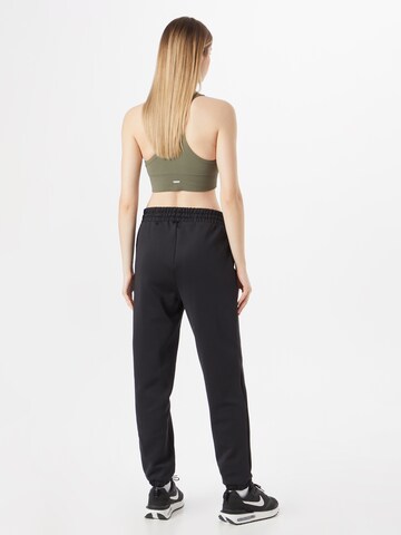 Effilé Pantalon de sport 'Ruby' HKMX en noir