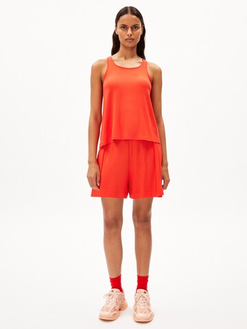 ARMEDANGELS Loose fit Trousers 'AAREZU' in Orange