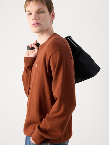 Pull-over Calvin Klein Jeans en rouge