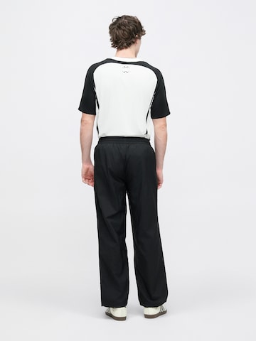 Loosefit Pantalon 'Adicolor' ADIDAS ORIGINALS en noir : derrière