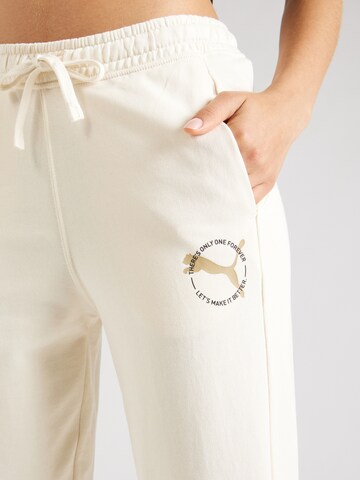 PUMA - Tapered Pantalón deportivo en beige