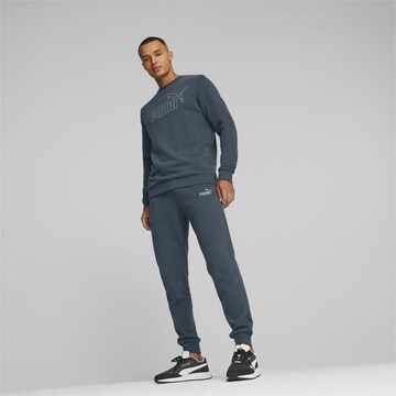 PUMA Tapered Sports trousers in Blue