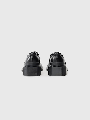 Papuci de casă 'Maybole' de la Dr. Martens pe negru