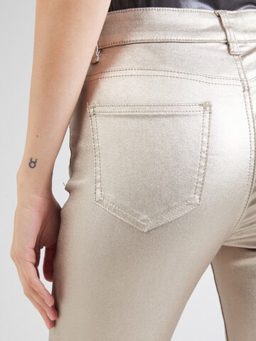 Skinny Jean Cartoon en or