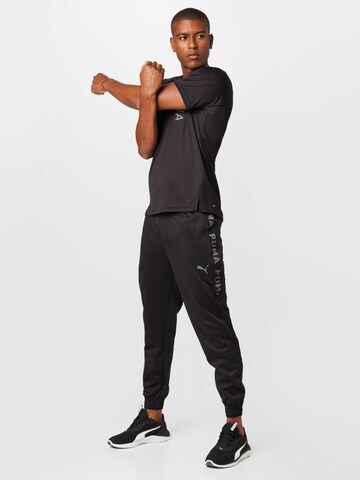 PUMA Tapered Sportbroek in Zwart