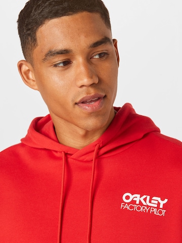 OAKLEY - Sweatshirt de desporto 'FREERIDE' em vermelho