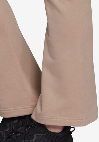 Flared Pantaloni di ADIDAS ORIGINALS in beige