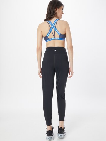 UNDER ARMOUR Tapered Sportbroek 'Meridian' in Zwart