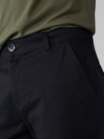 DAN FOX APPAREL - Tapered Pantalón cargo 'Damon' en negro