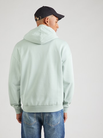 HUGO - Sweatshirt 'Ditchle' em verde