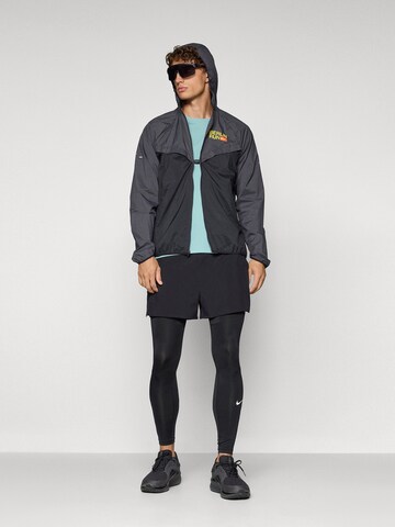 NIKE Sportdzseki 'City Marathon Stride' - fekete