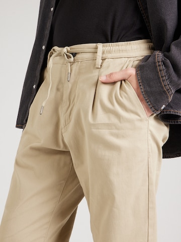 Lindbergh Tapered Pleat-front trousers 'Superflex' in Beige