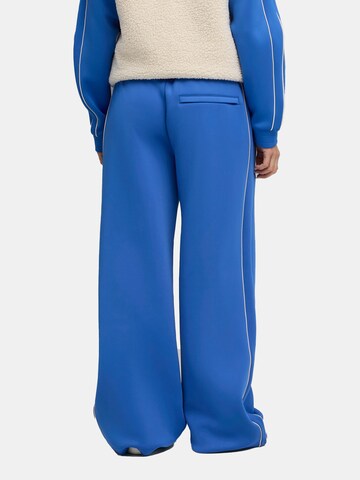 PUMA Regular Workout Pants ' T7' in Blue
