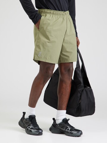 On Loose fit Sports trousers in Green: front