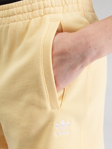 ADIDAS ORIGINALS Loose fit Pants 'Essentials' in Yellow