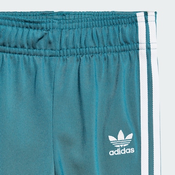 ADIDAS ORIGINALS Träningsoverall 'Adicolor' i grön