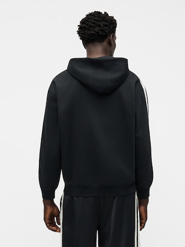 ADIDAS ORIGINALS Collegetakki 'Adicolor' värissä musta