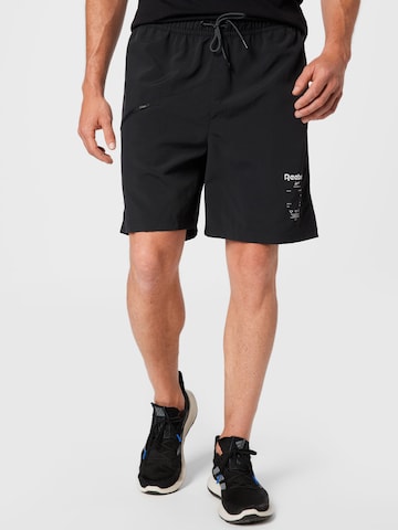 Loosefit Pantaloni sport de la Reebok pe negru: față