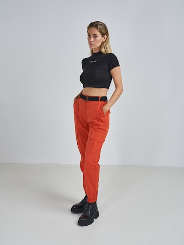 ABOUT YOU x Swalina&Linus Tapered Cargobroek 'Mira' in Oranje