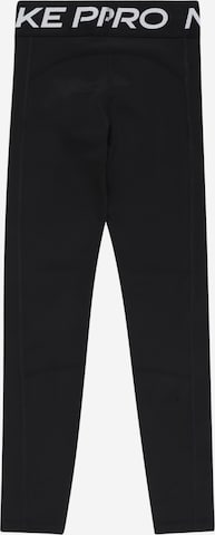 NIKE Skinny Sporthose in Schwarz