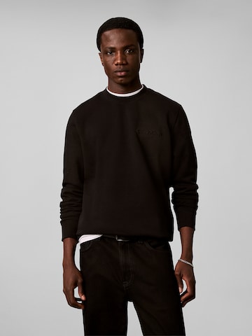 Sweat-shirt Calvin Klein en noir : devant