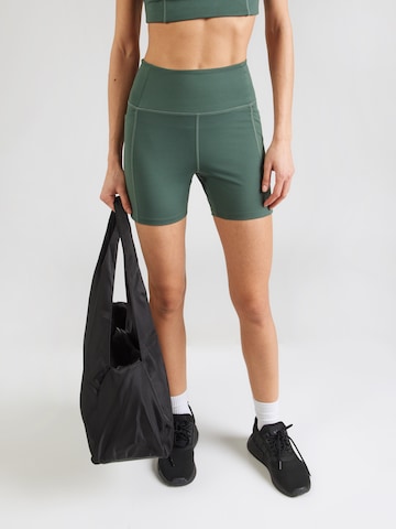 Girlfriend Collective Skinny Sportovní kalhoty – zelená: přední strana
