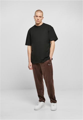 Karl Kani Regular Trousers in Brown