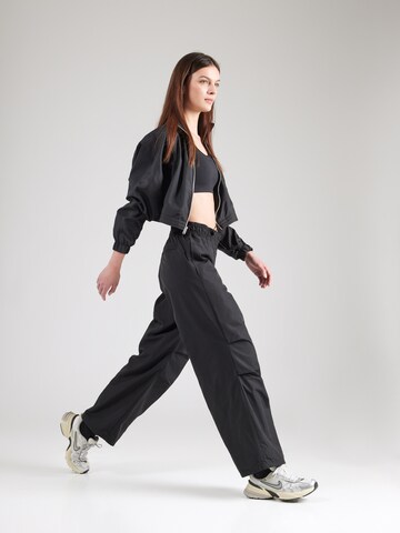 Nike Sportswear Wide leg Trousers 'Repel' in Black