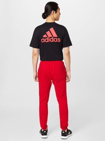 ADIDAS SPORTSWEAR Slim fit Workout Pants 'Pinstripe Fleece' in Red