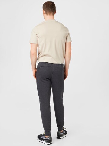 Effilé Pantalon de sport PUMA en gris