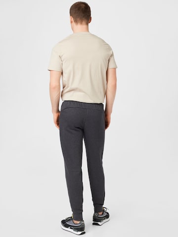 PUMA - Tapered Pantalón deportivo en gris