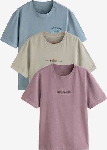 Next T-shirt i blå: framsida