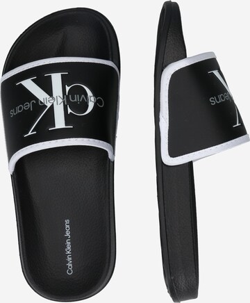 Calvin Klein Jeans Sandals & Slippers in Black