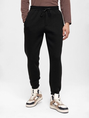 Antioch Tapered Trousers in Black