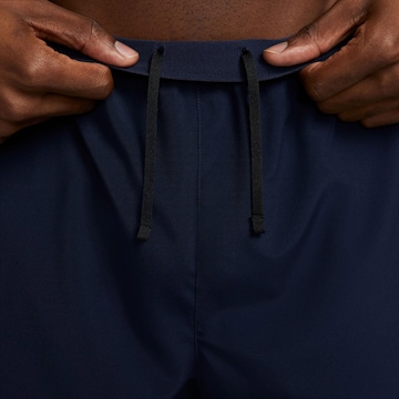 NIKE Regularen Športne hlače 'Challenger' | modra barva