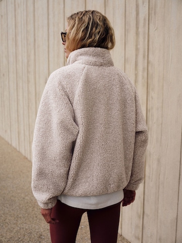 Pull-over self. en beige