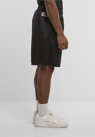 regular Pantaloni di Karl Kani in nero