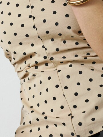 Top 'Deddi' di co'couture in beige