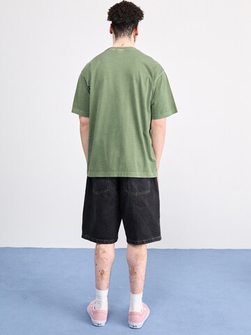 Carhartt WIP Avar lõige Teksapüksid 'Brandon', värv must